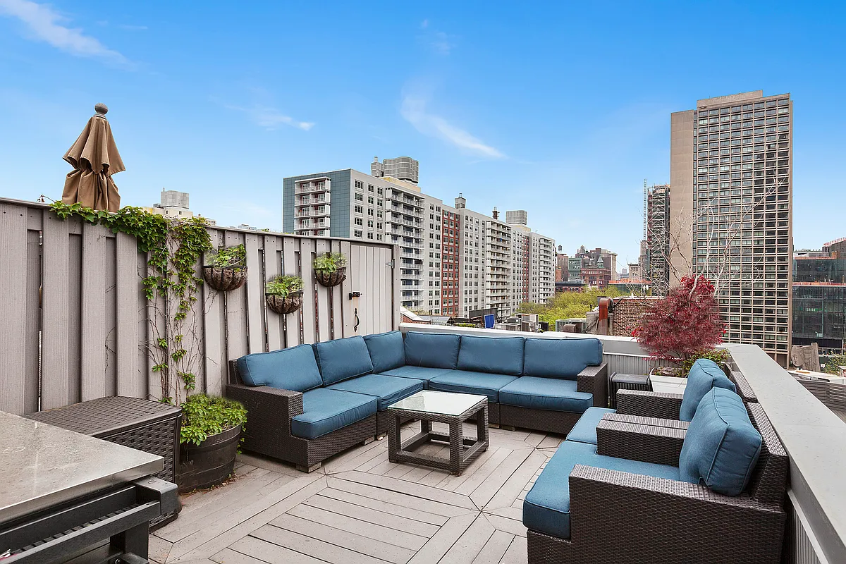 a view of balcony with couch and outdoor seating