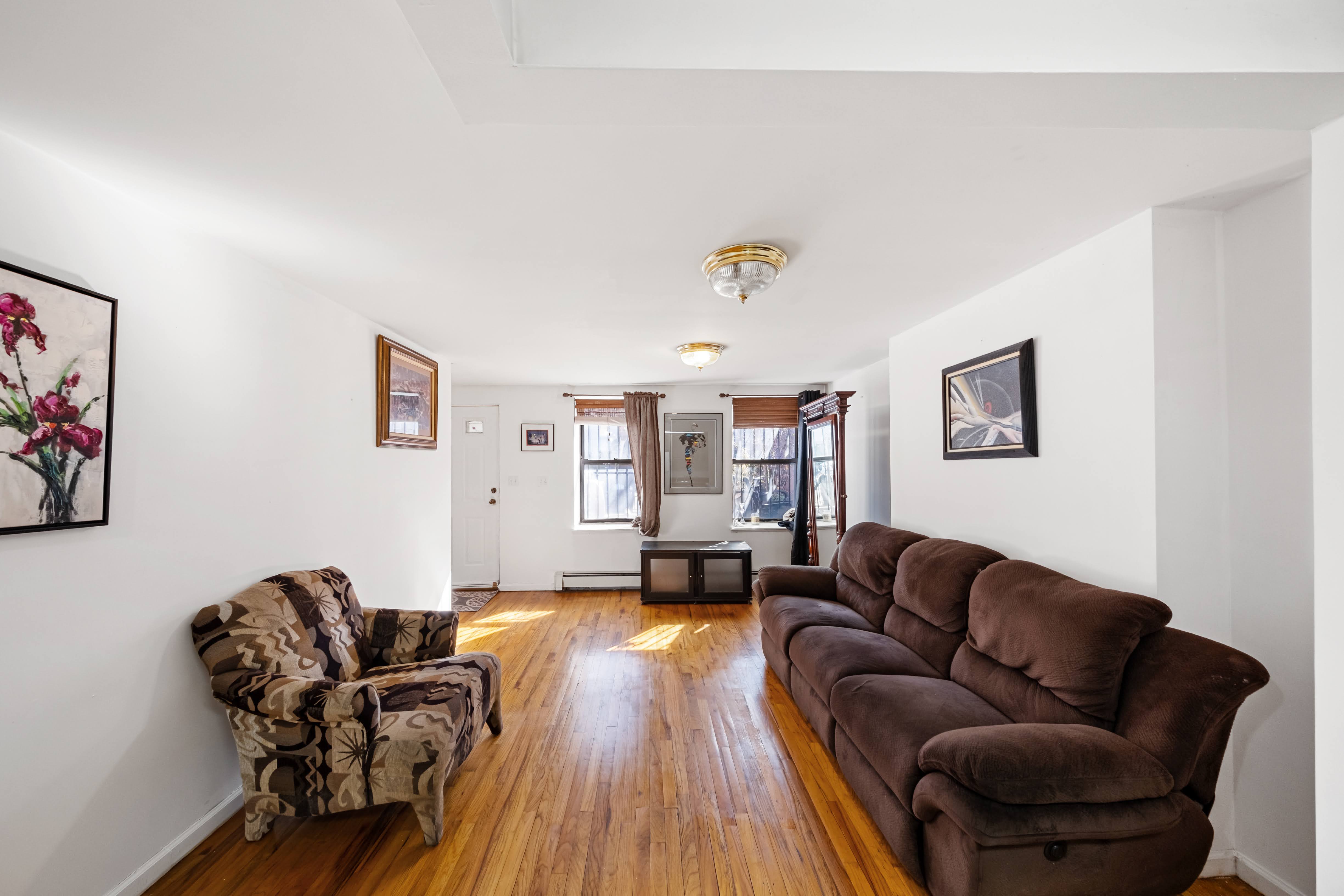 275 Van Buren Street Brooklyn, NY 11221 - Photo 19 of 33 a living room with furniture and wooden floor