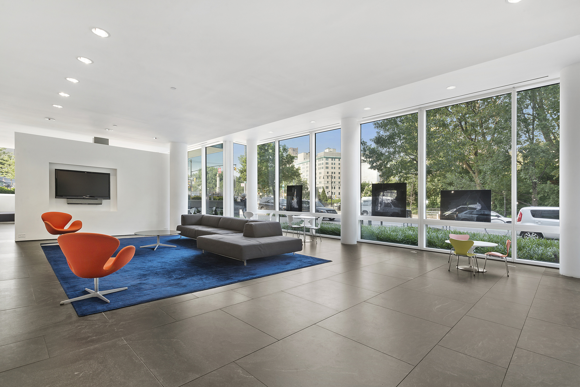 1 Grand Army Plaza, Unit 9D Brooklyn, NY 11238 - Photo 13 of 20 a living room with furniture and a floor to ceiling window