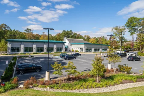 a view of a building with a yard