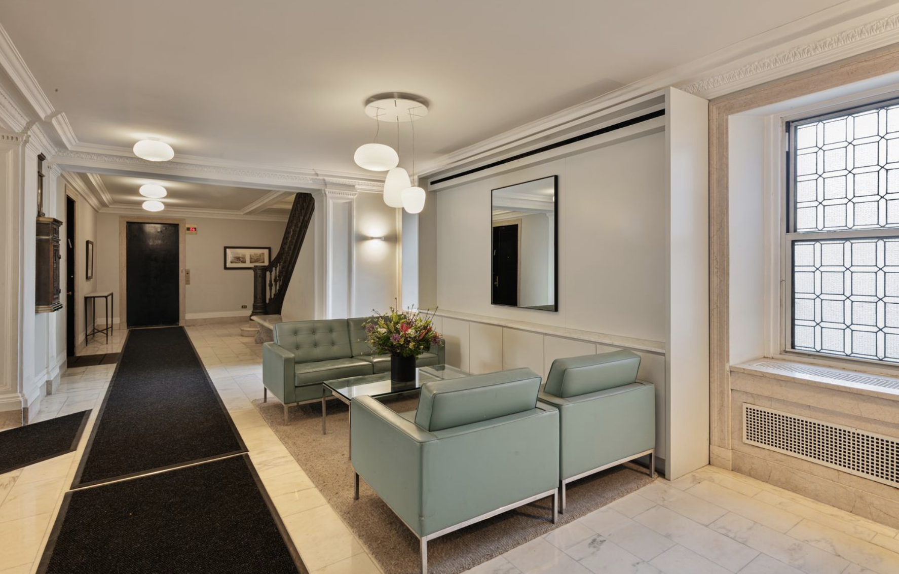 160 Riverside Drive, Unit 8A Manhattan, NY 10024 - Photo 10 of 15 a living room with furniture and a fireplace