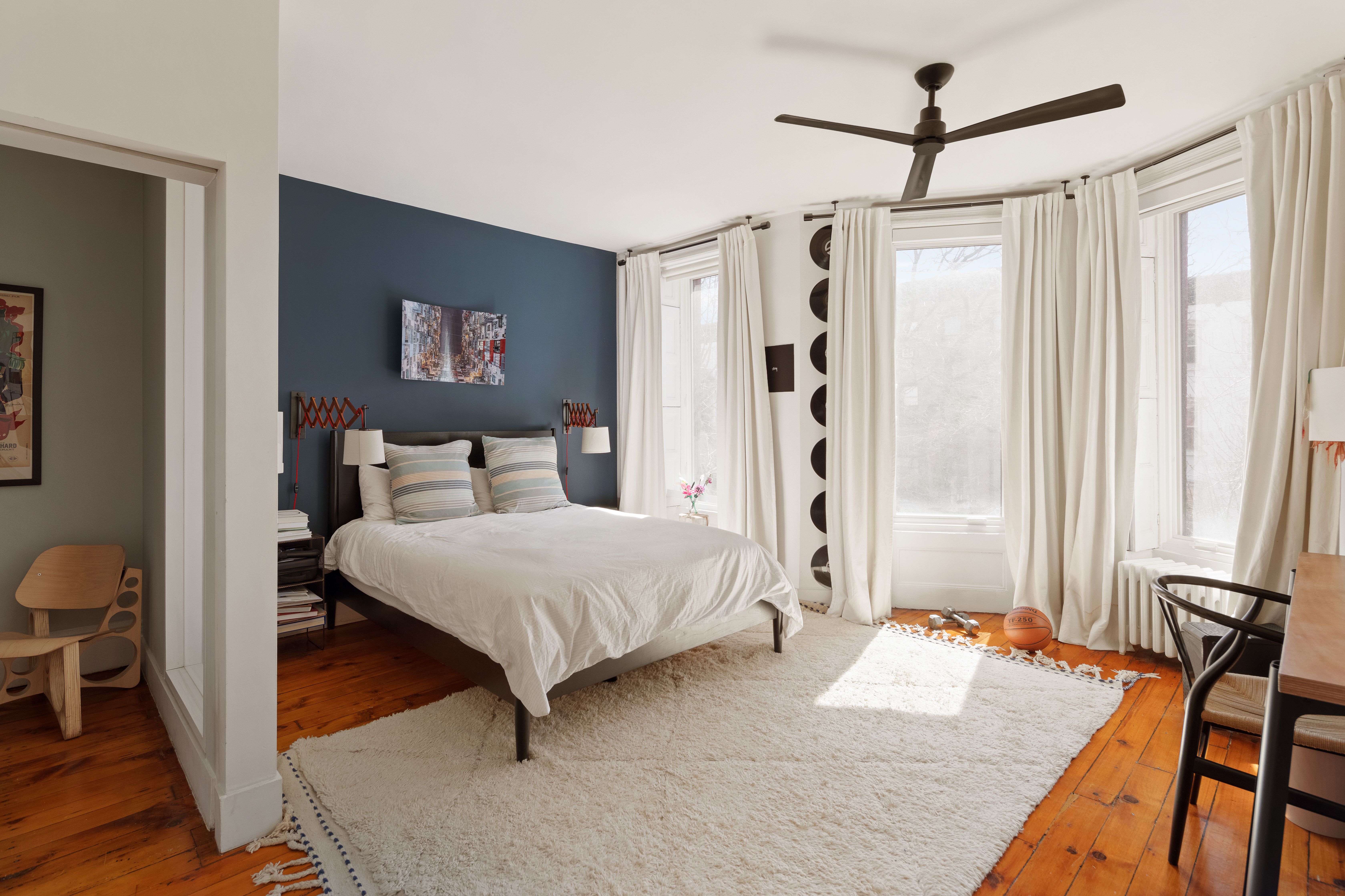 171 Garfield Place Brooklyn, NY 11215 - Photo 7 of 19 a bedroom with a bed and a chandelier