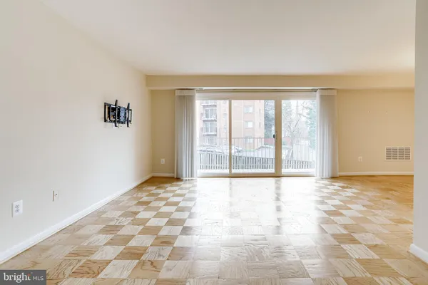 a view of an empty room and window
