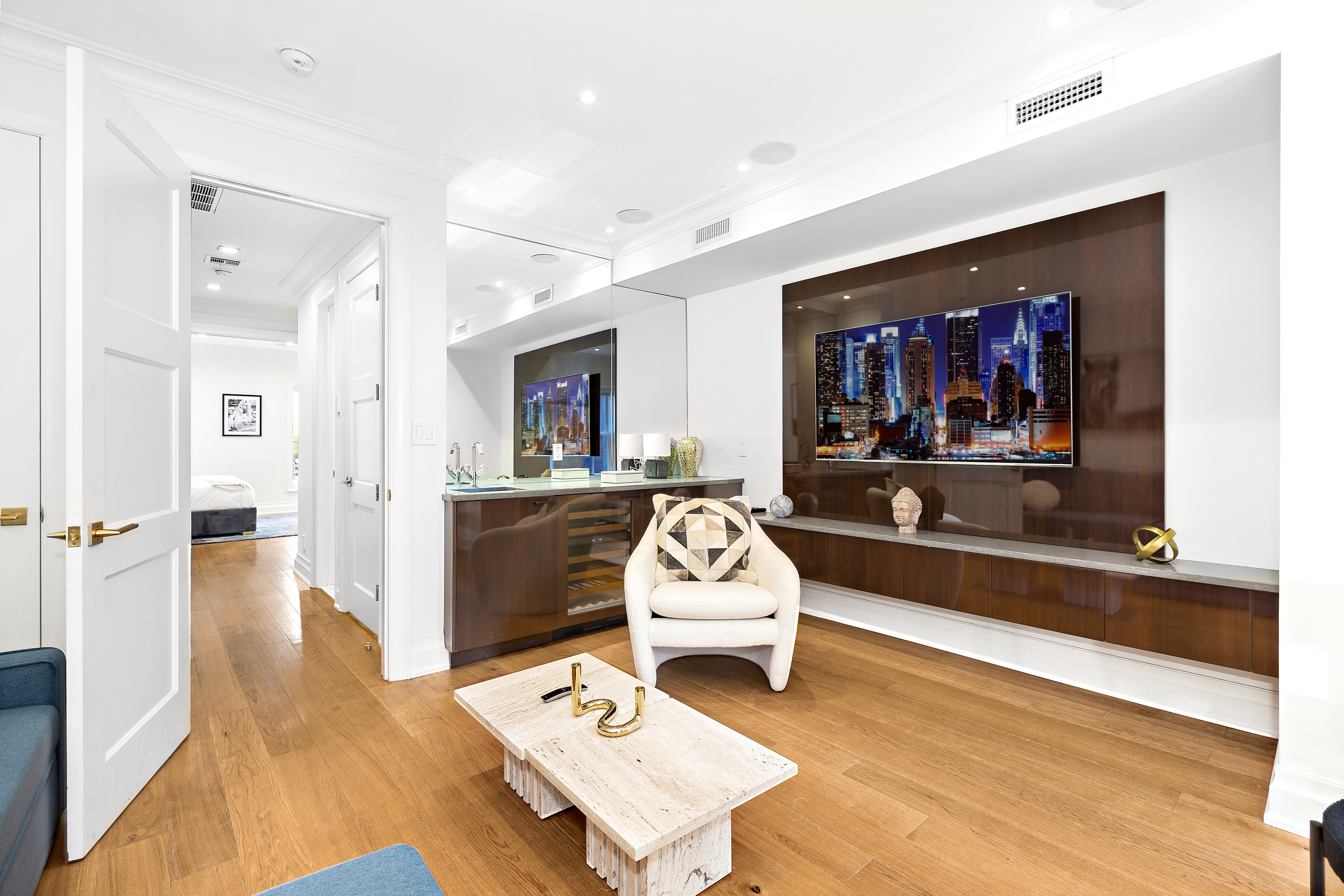 134 East 36th Street Manhattan, NY 10016 - Photo 6 of 28 a living room with furniture and a flat screen tv