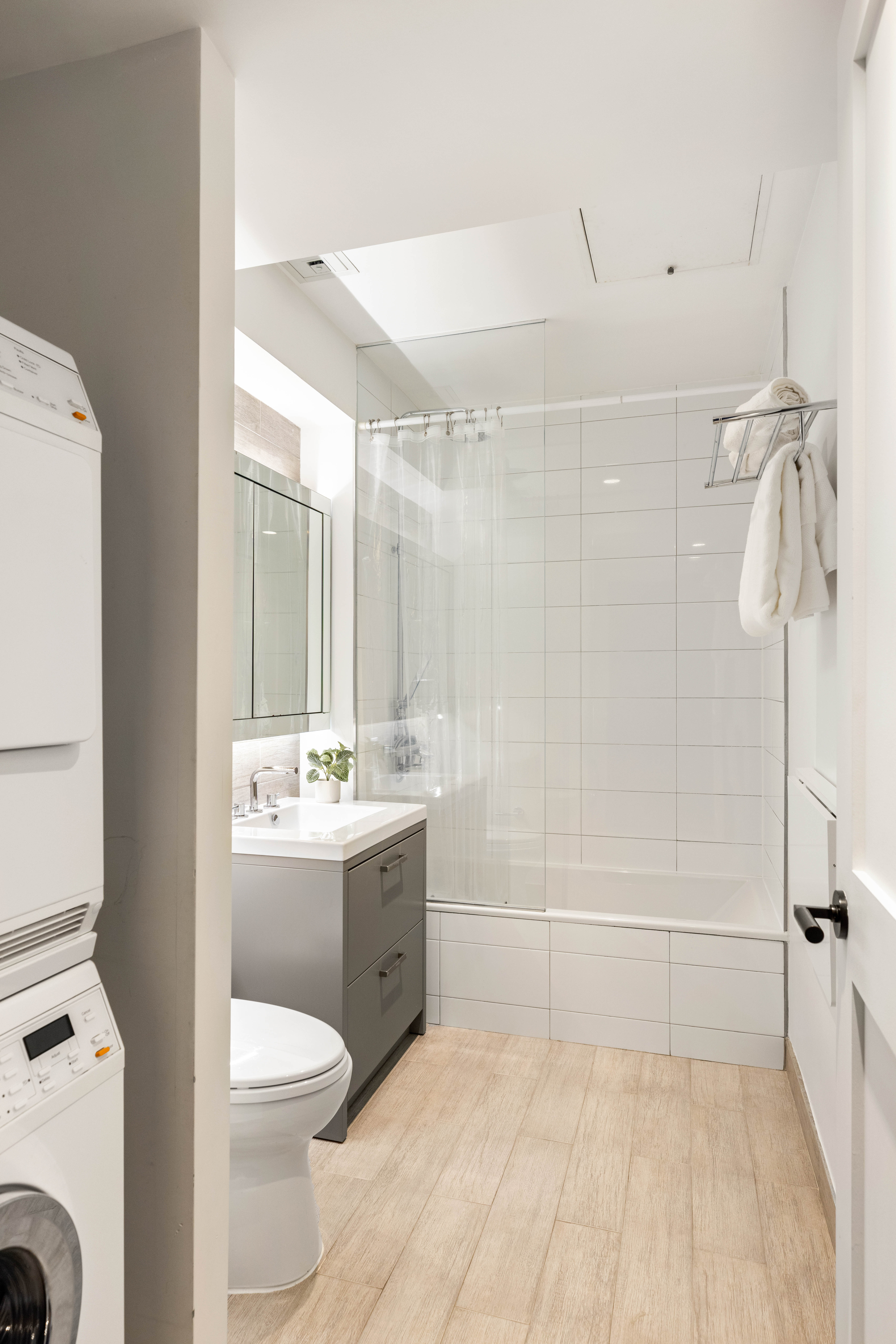 172 North 10th Street, Unit 3D Brooklyn, NY 11211 - Photo 9 of 16 a bathroom with a sink a toilet and shower