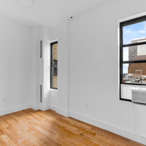 317 West 87th Street, Unit 8C Manhattan, NY 10024 - Photo 4 of 9 a view of an empty room with window and wooden floor