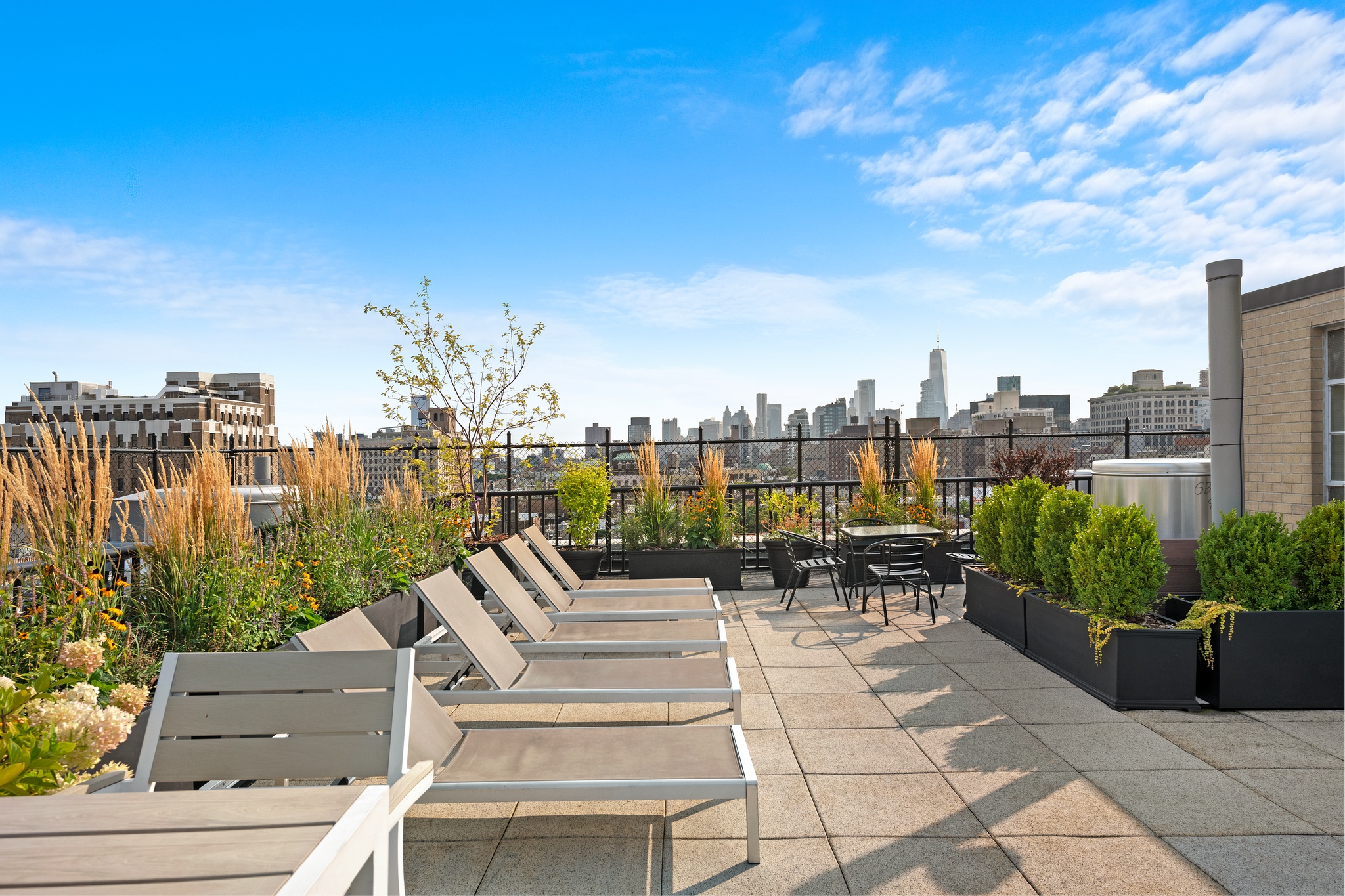 230 East 15th Street, Unit 7P Manhattan, NY 10003 - Photo 6 of 8 a view of a patio with couches and city view
