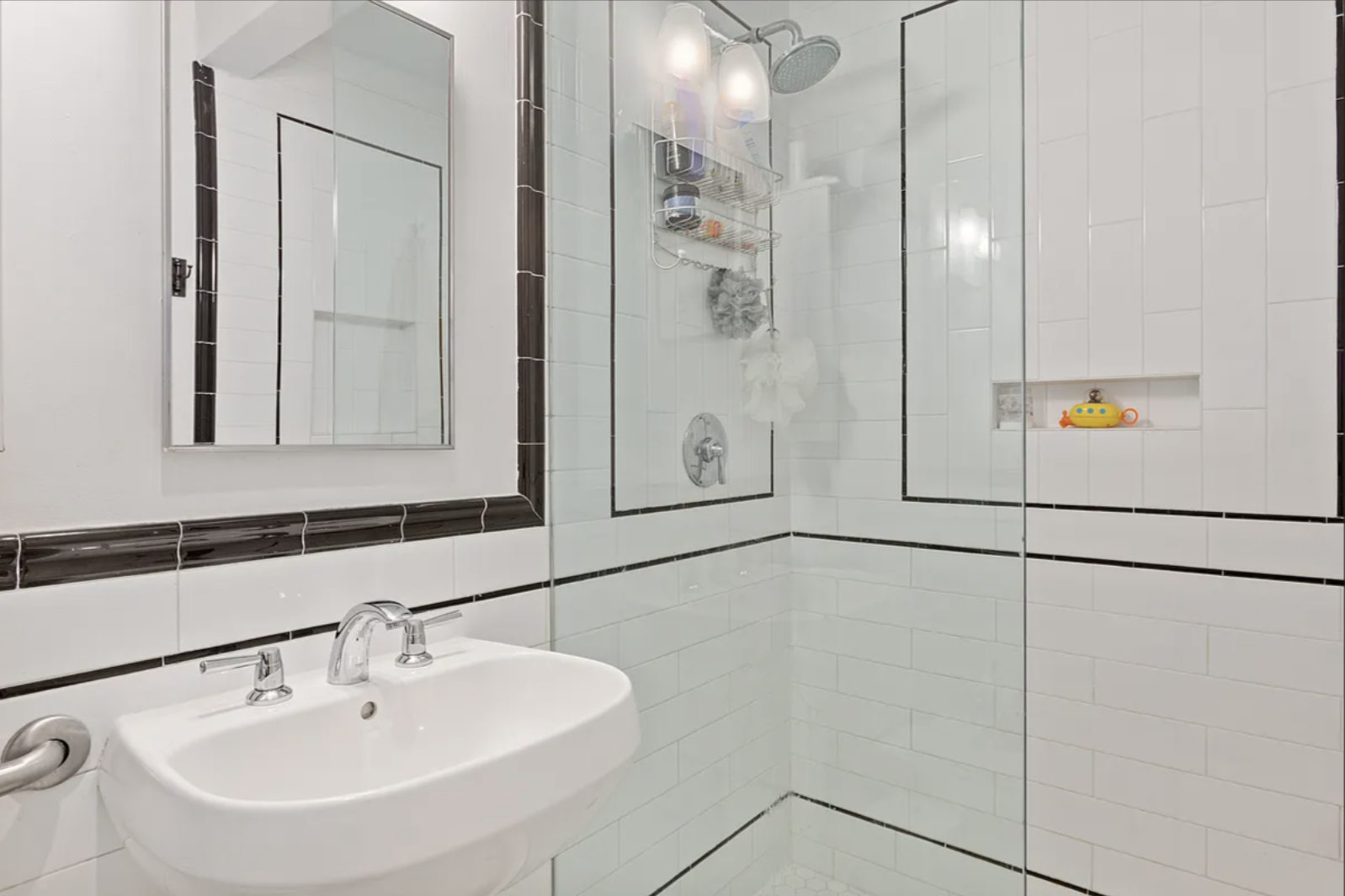 200 Franklin Street, Unit 4B Brooklyn, NY 11222 - Photo 3 of 10 a bathroom with a sink and mirror
