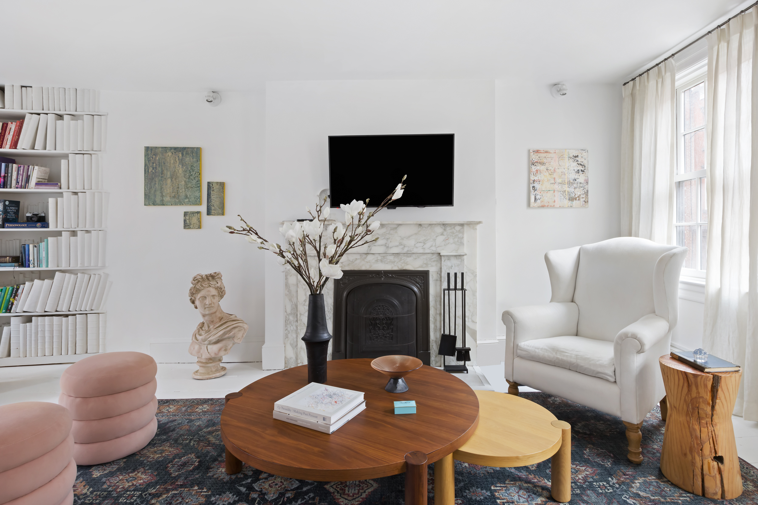 49 Barrow Street Manhattan, NY 10014 - Photo 4 of 25 a living room with furniture a flat screen tv and a fireplace