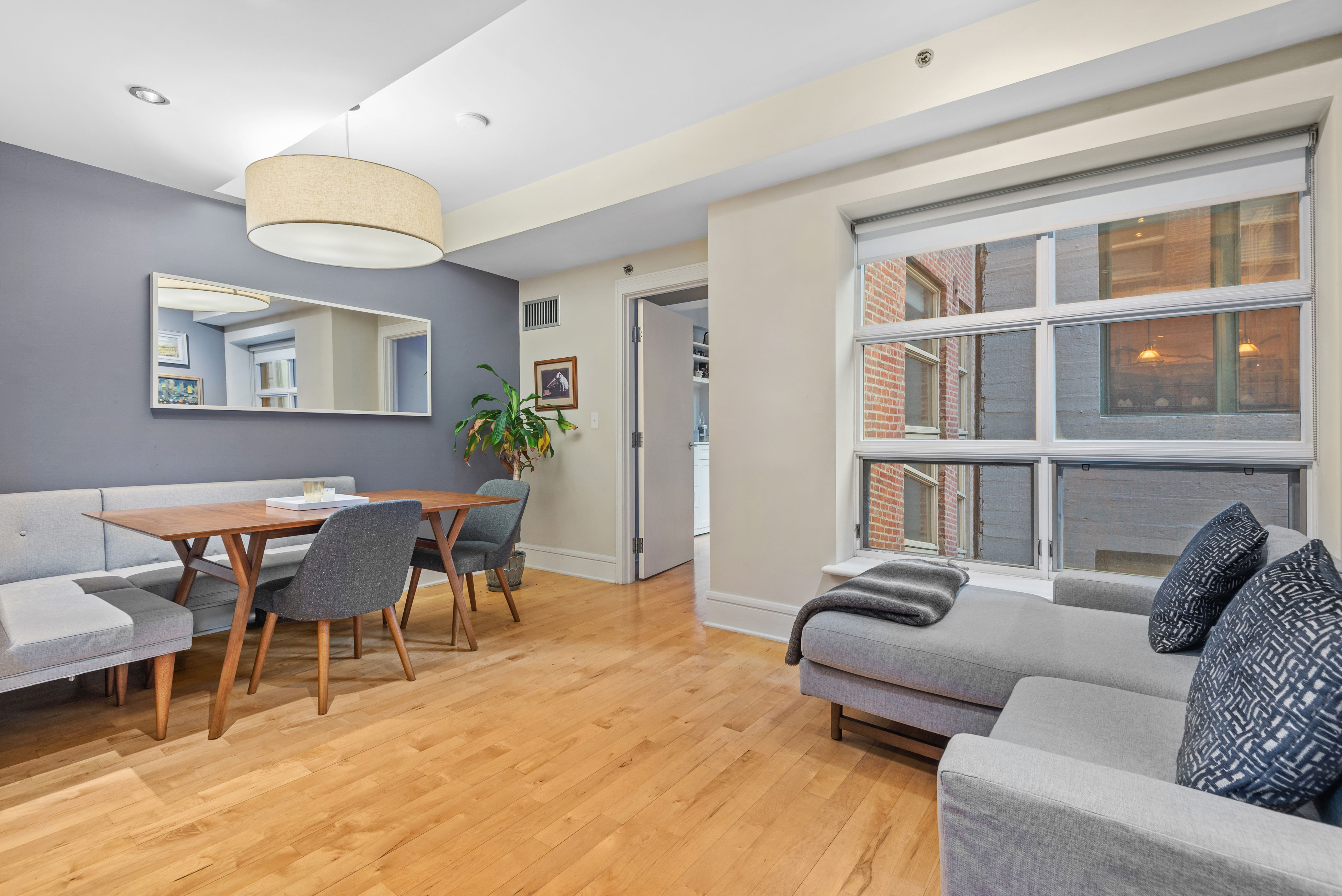 57 Front Street, Unit 305 Brooklyn, NY 11201 - Photo 4 of 10 a living room with furniture potted plant and a window