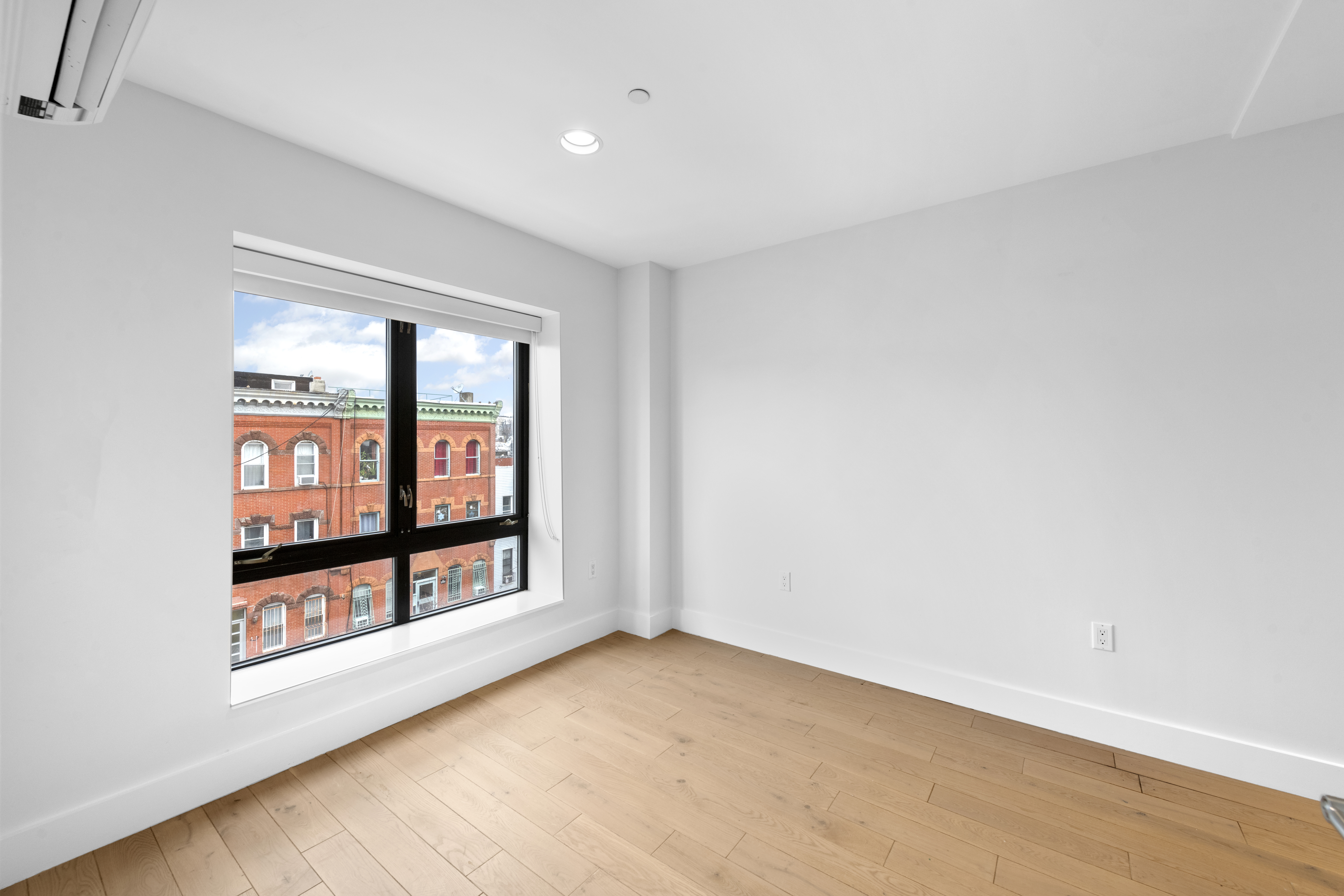 1164 Greene Avenue, Unit PHA Brooklyn, NY 11221 - Photo 5 of 13 an empty room with windows