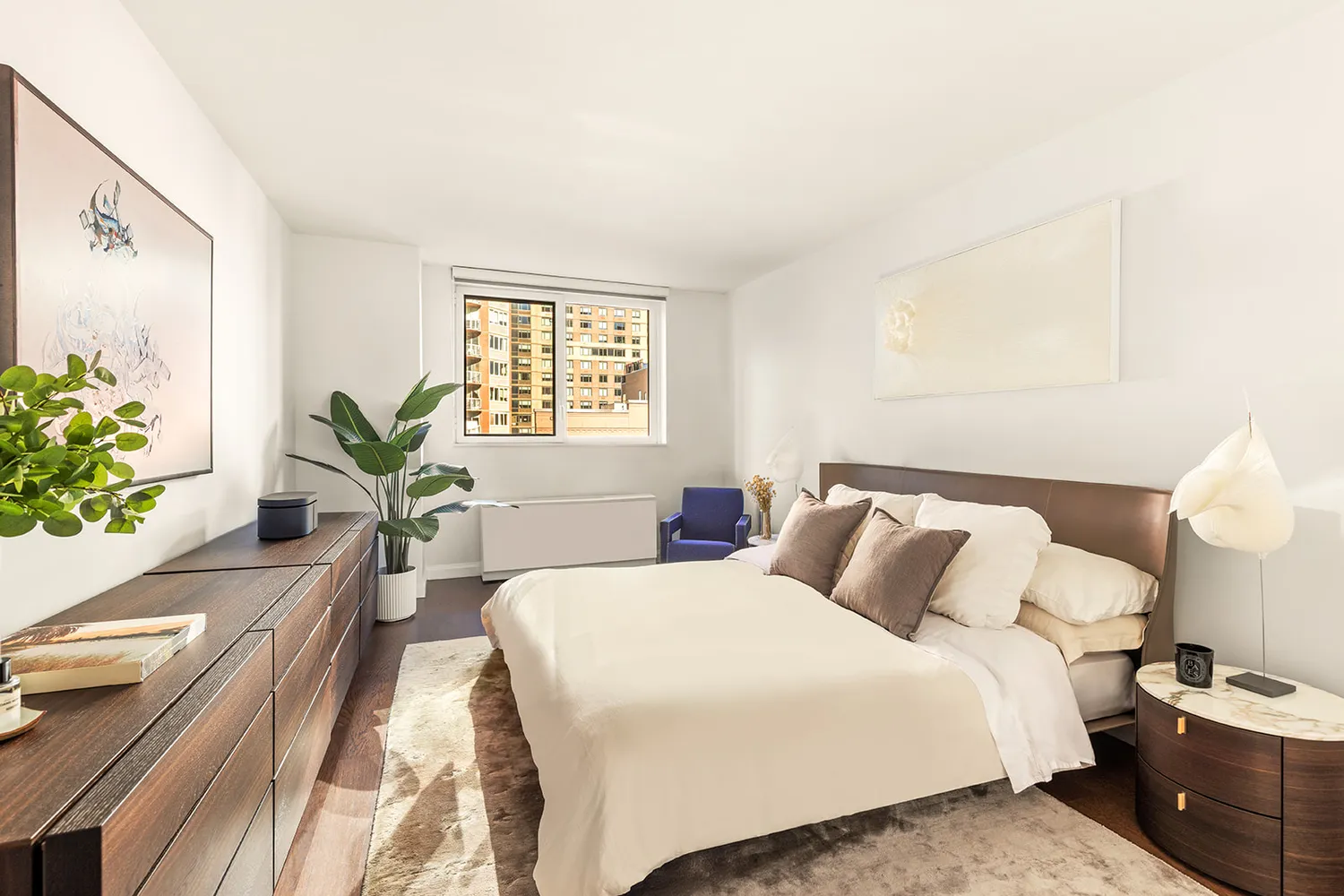 a bedroom with a bed and a table in it