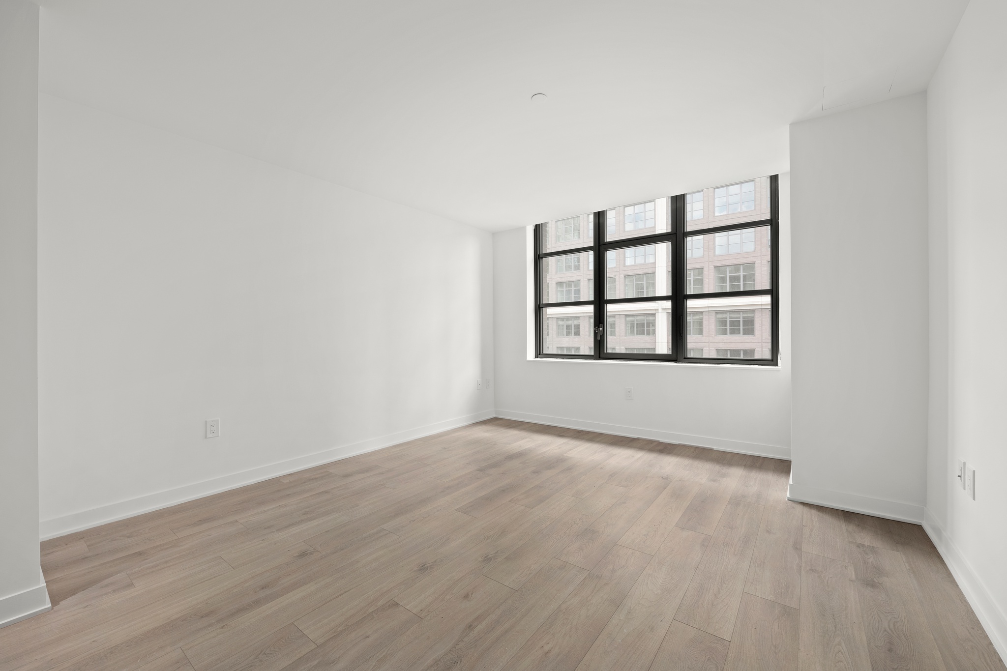 160 Front Street, Unit 517 Brooklyn, NY 11201 - Photo 4 of 14 wooden floor in an empty room