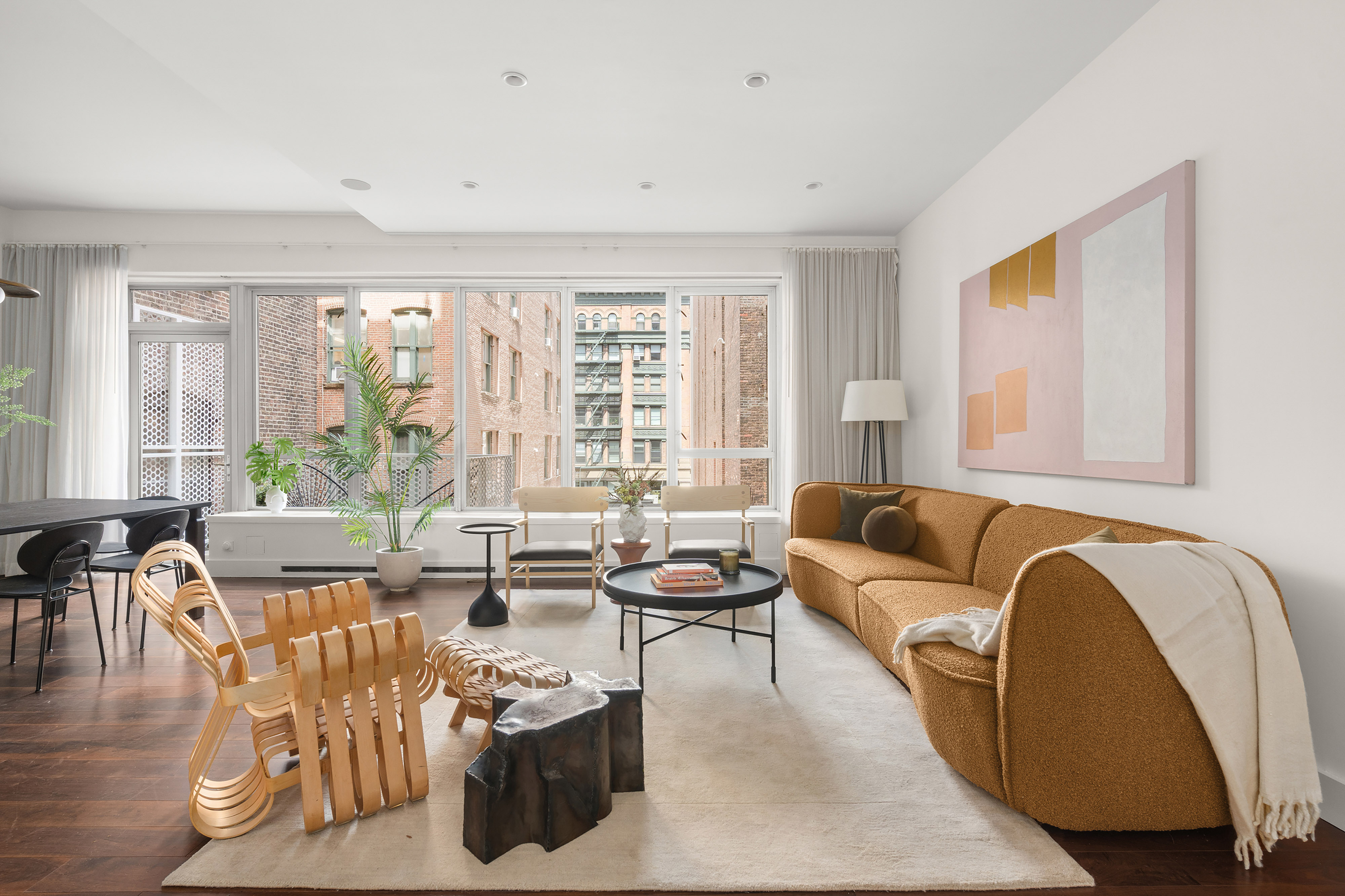 48 Bond Street, Unit 4B Manhattan, NY 10012 - Photo 2 of 15 a living room with furniture and floor to ceiling windows
