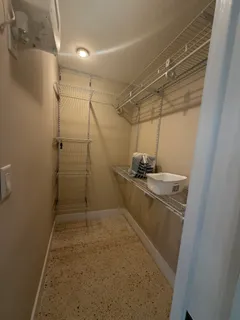 a bathroom with a shower and a sink