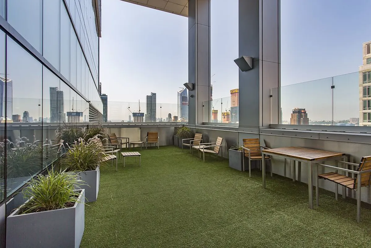 350 West 42nd Street, Unit 20G Manhattan, NY 10036 - Photo 11 of 27 a view of an ocean with outdoor seating