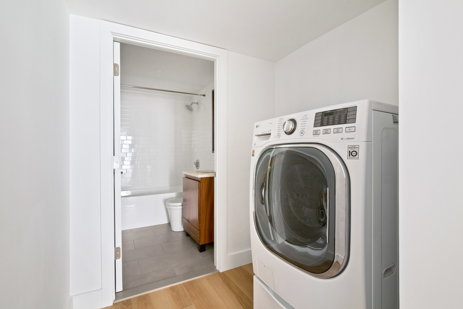 277 Greene Avenue, Unit B Brooklyn, NY 11238 - Photo 11 of 13 a view of a hallway with washer and dryer