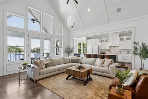 a living room with furniture dining area and a view of kitchen
