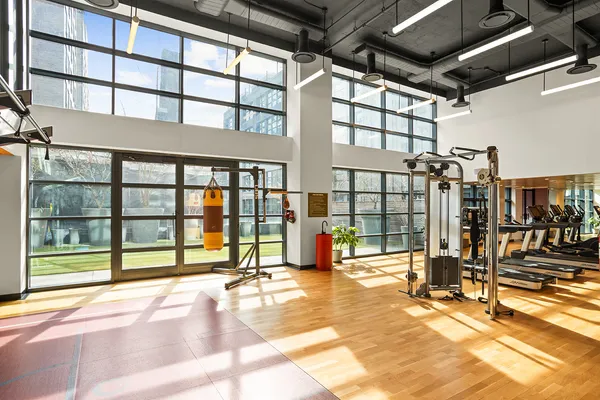 a view of a hall with floor to ceiling windows