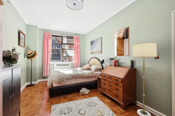 a bed room with a bed and a lamp