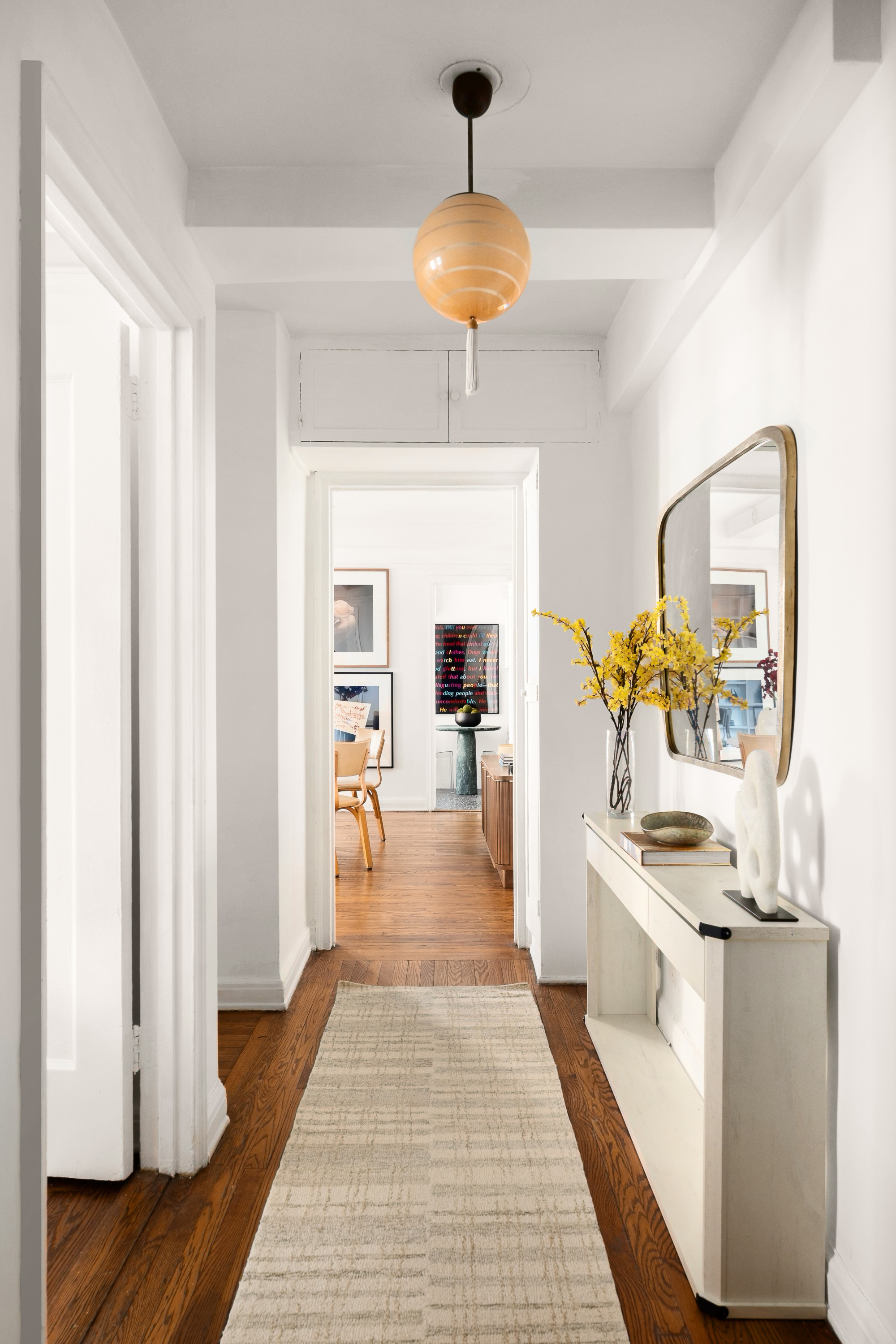 465 West 23rd Street, Unit 10A Manhattan, NY 10011 - Photo 6 of 12 a view of living room with furniture and chandelier