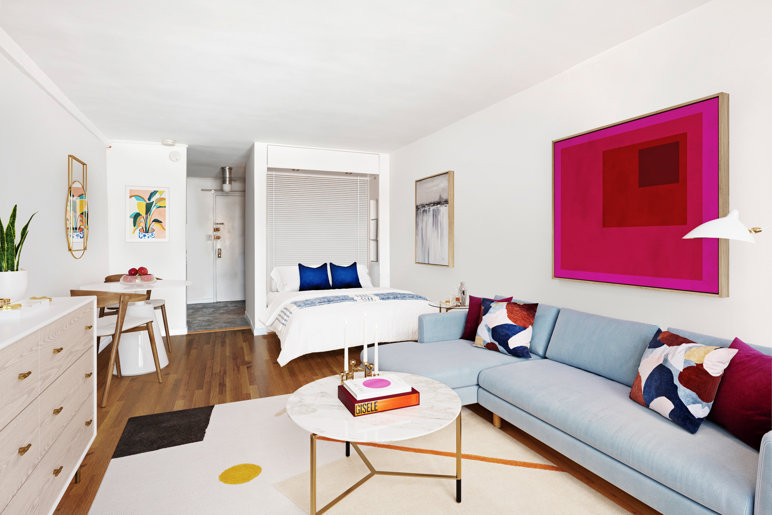 165 Christopher Street, Unit 6J Manhattan, NY 10014 - Photo 2 of 16 a living room with furniture and a wooden floor