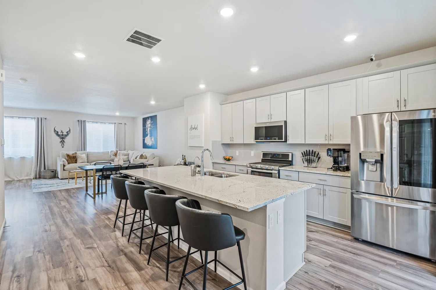 a kitchen with appliances a sink a counter top space and cabinets