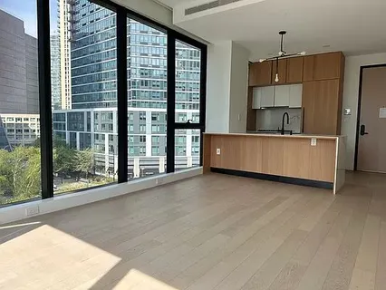 a view of a kitchen with a sink and a window
