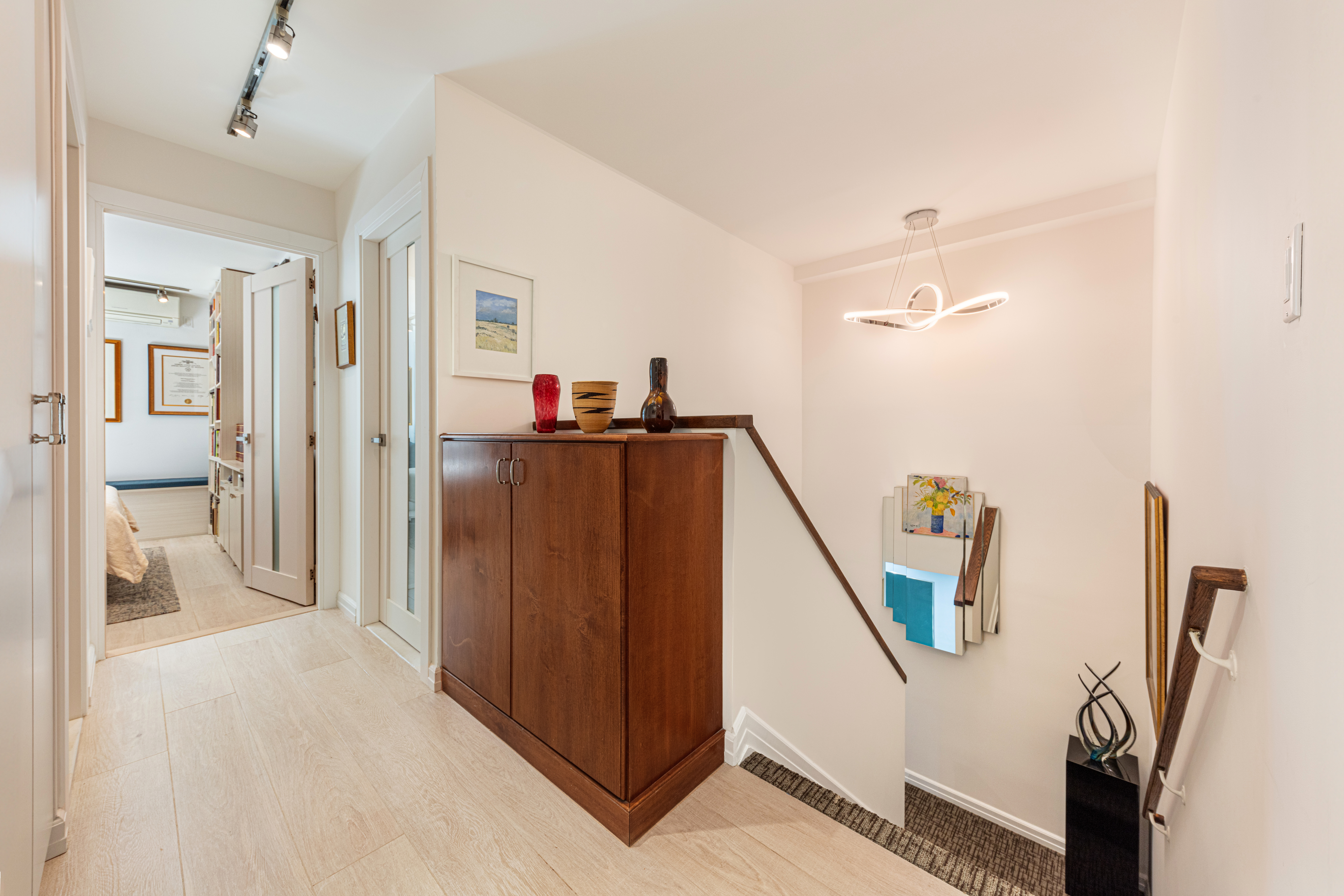 129 Barrow Street, Unit GA Manhattan, NY 10014 - Photo 10 of 17 a view of a hallway with workspace
