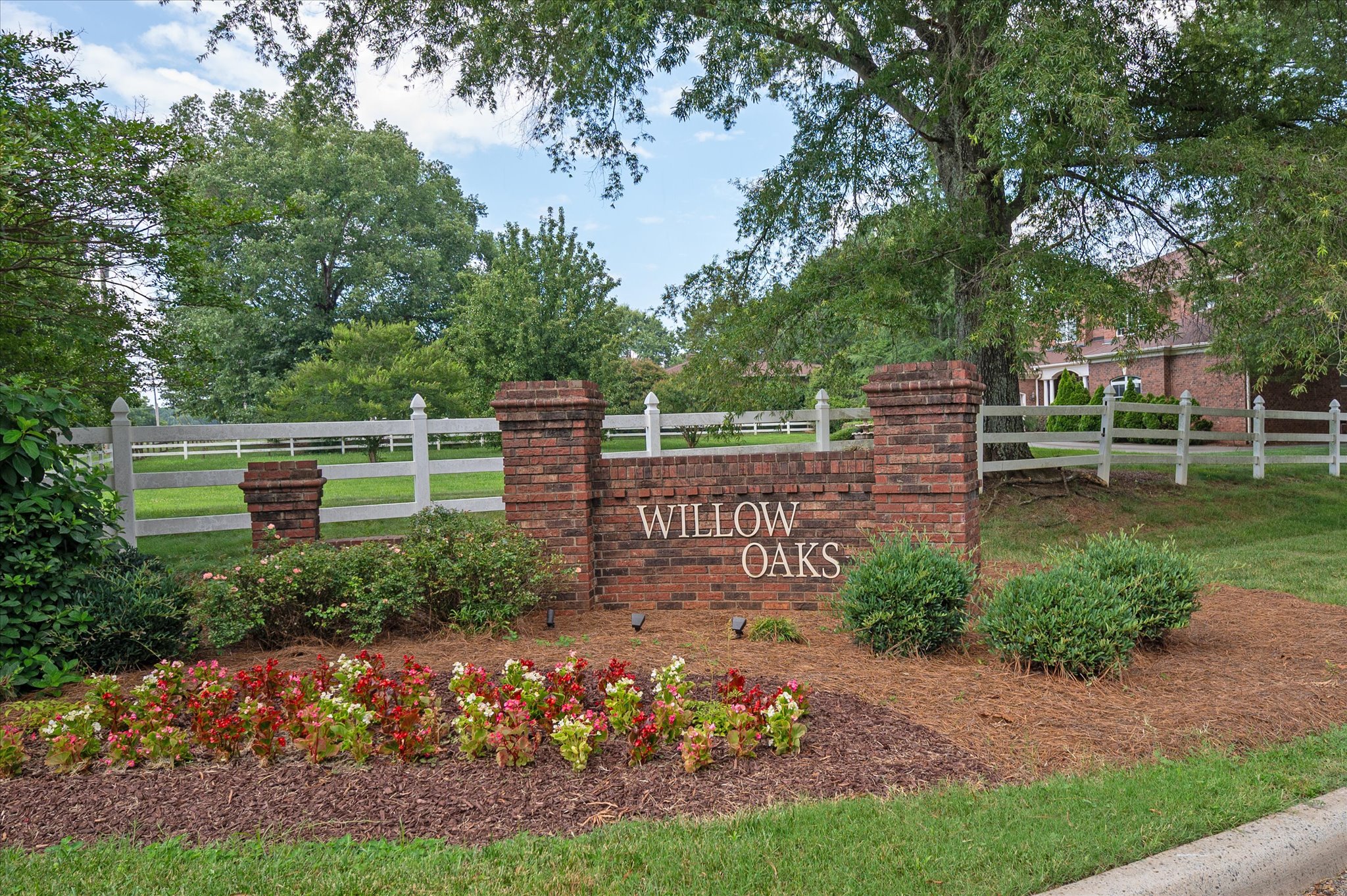 37 Willow Oaks Trail Weddington, NC 28104 - Photo 5 of 5 a view of a garden with wooden bench