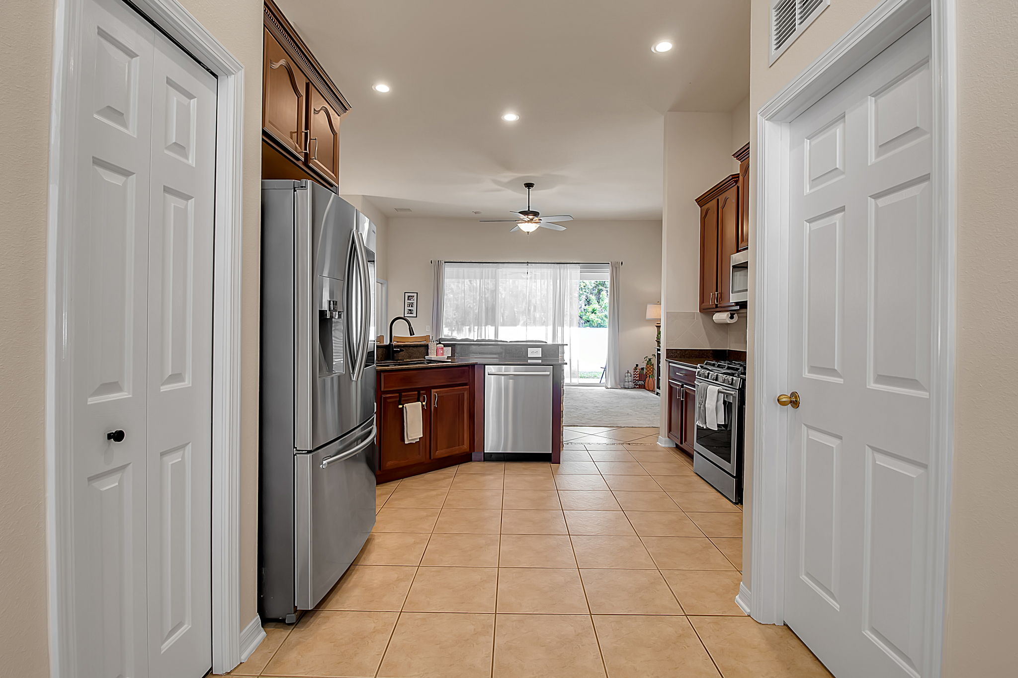 6106 34th Court East Bradenton, FL 34203 - Photo 22 of 69 a kitchen with stainless steel appliances a refrigerator and a sink
