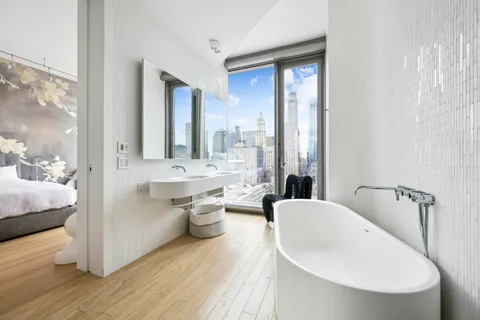 a bathroom with a bathtub sink and toilet