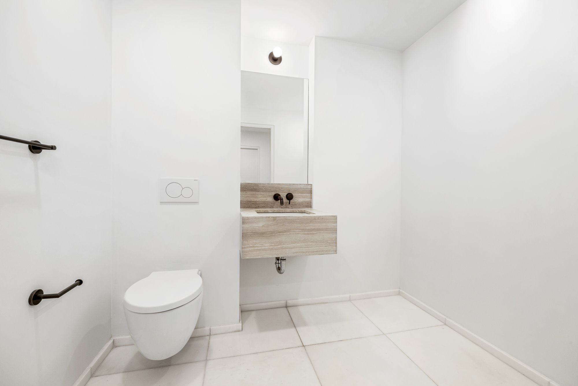 66 Clinton Street, Unit 1A Manhattan, NY 10002 - Photo 13 of 20 a bathroom with a toilet