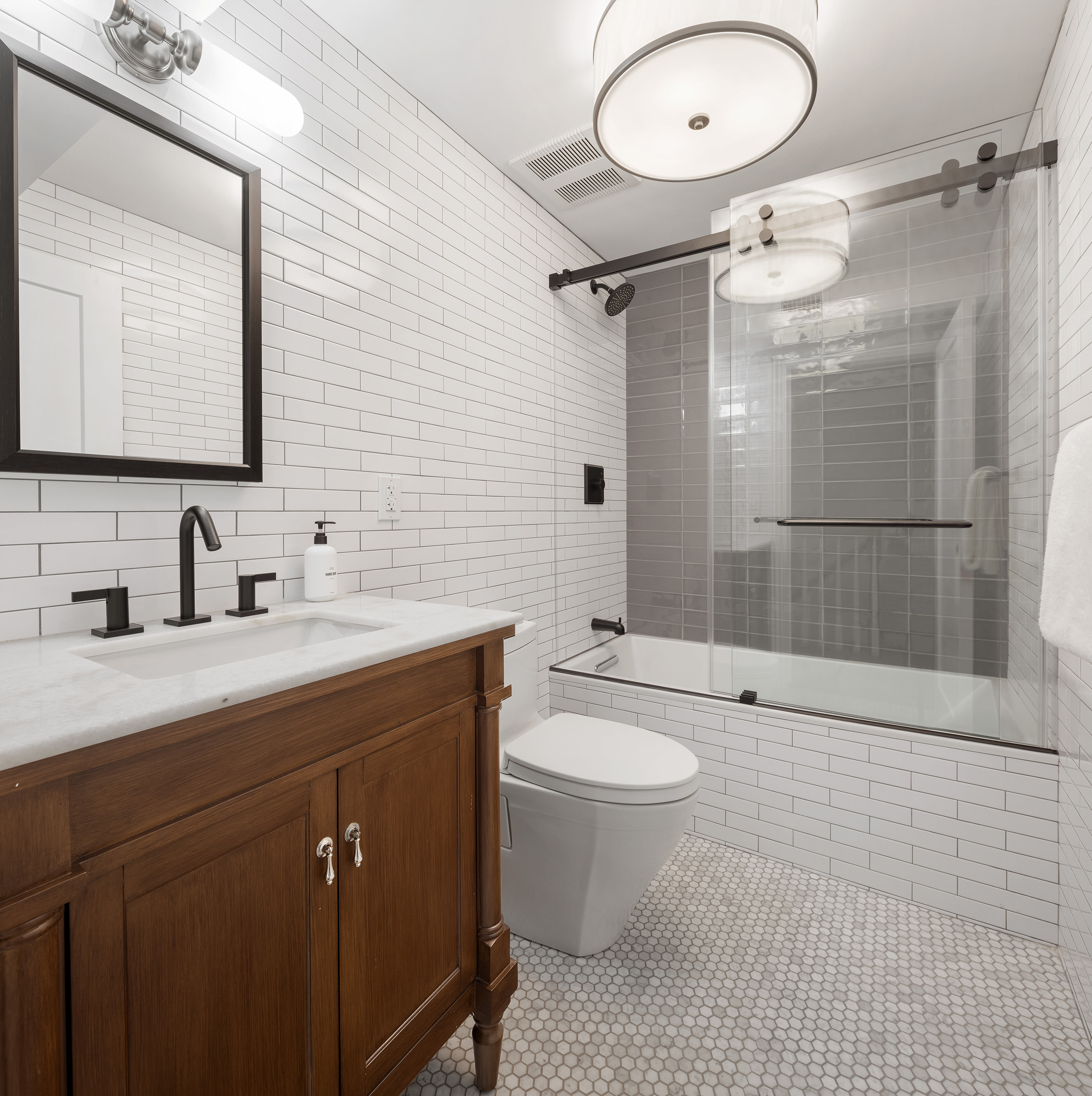 149 Kane Street Brooklyn, NY 11231 - Photo 20 of 26 a bathroom with a double vanity sink mirror double shower and a toilet