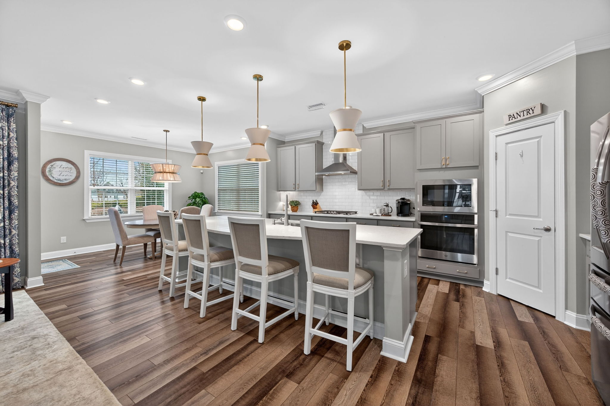 118 Mahogany Run Raleigh, NC 27610 - Photo 15 of 43 a view of a kitchen with dining room and wooden floor