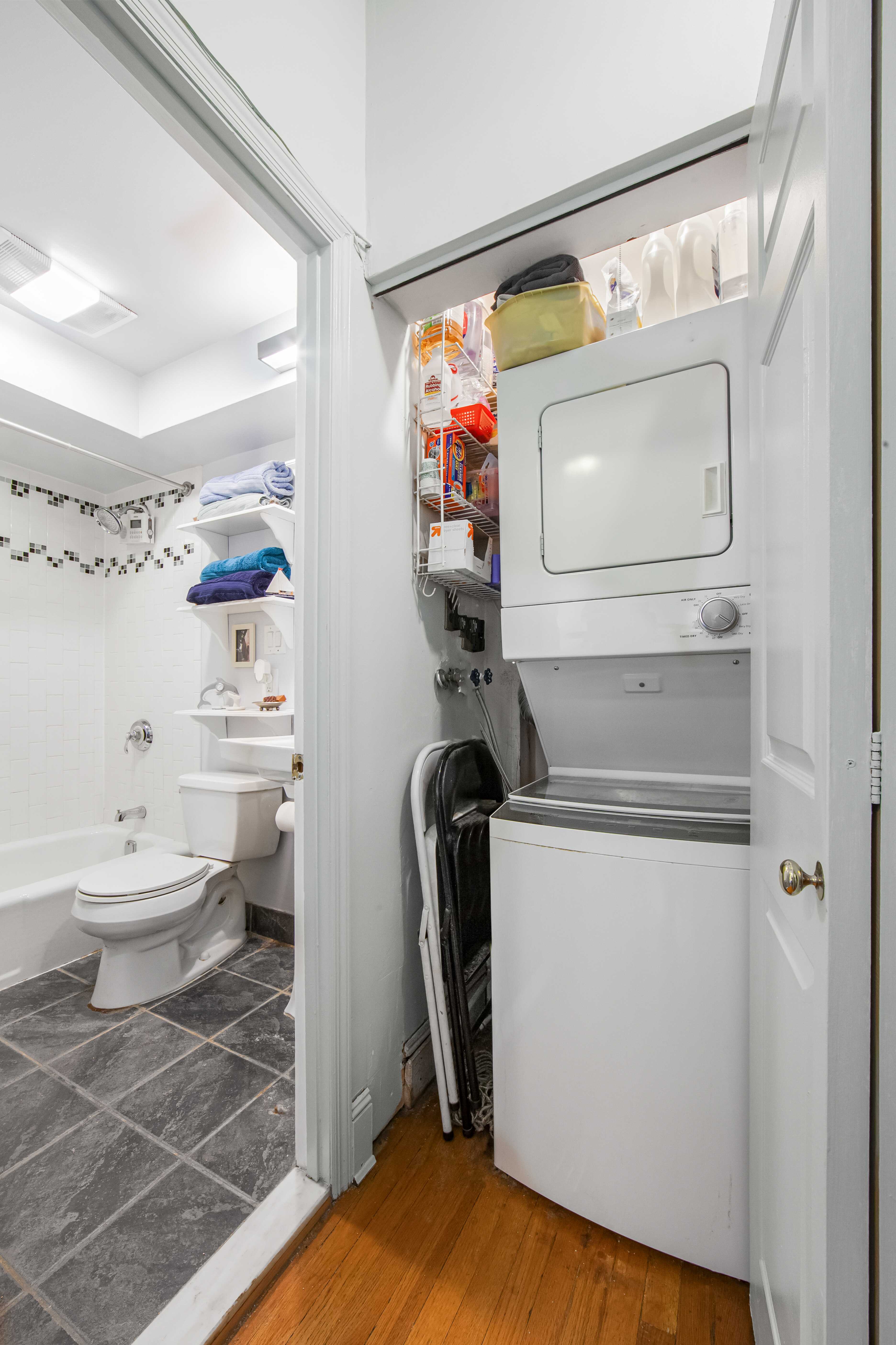 254 Park Place, Unit 4B Brooklyn, NY 11238 - Photo 6 of 12 a bathroom with a toilet a sink and a mirror