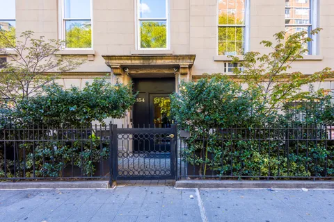 a potted plant sitting on the side of a building