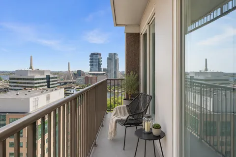 a view of a balcony with chairs