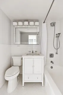 a bathroom with a sink a toilet and a bathtub