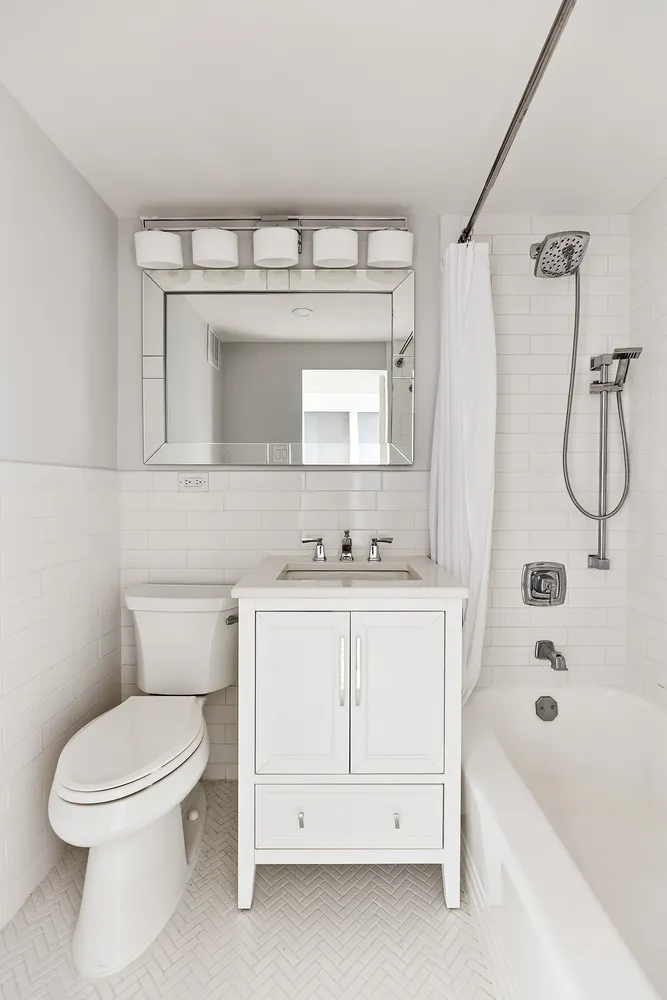 a bathroom with a sink a toilet and a bathtub