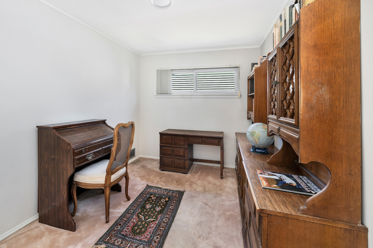 16-08 202nd Street Queens, NY 11360 - Photo 7 of 13 a living room with furniture and a piano
