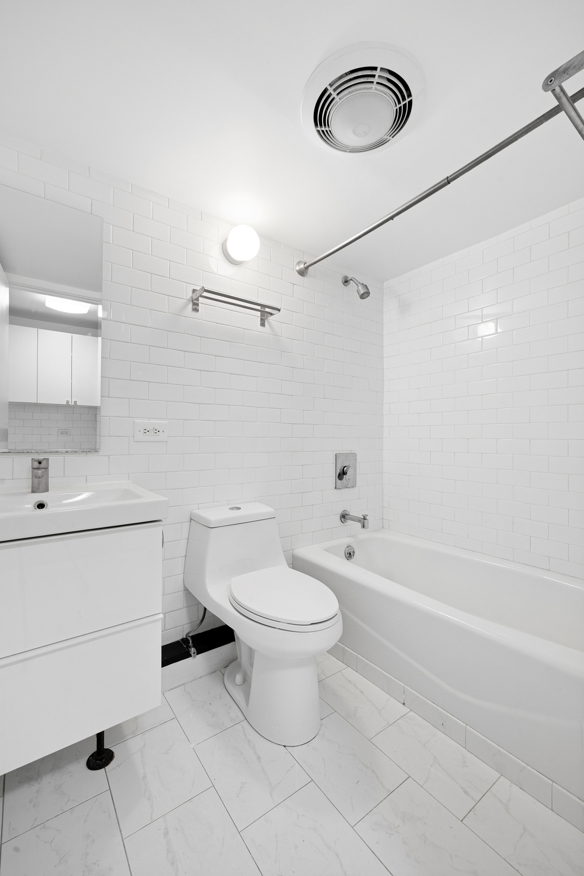 63 Putnam Avenue Brooklyn, NY 11238 - Photo 4 of 11 a bathroom with a sink toilet and shower