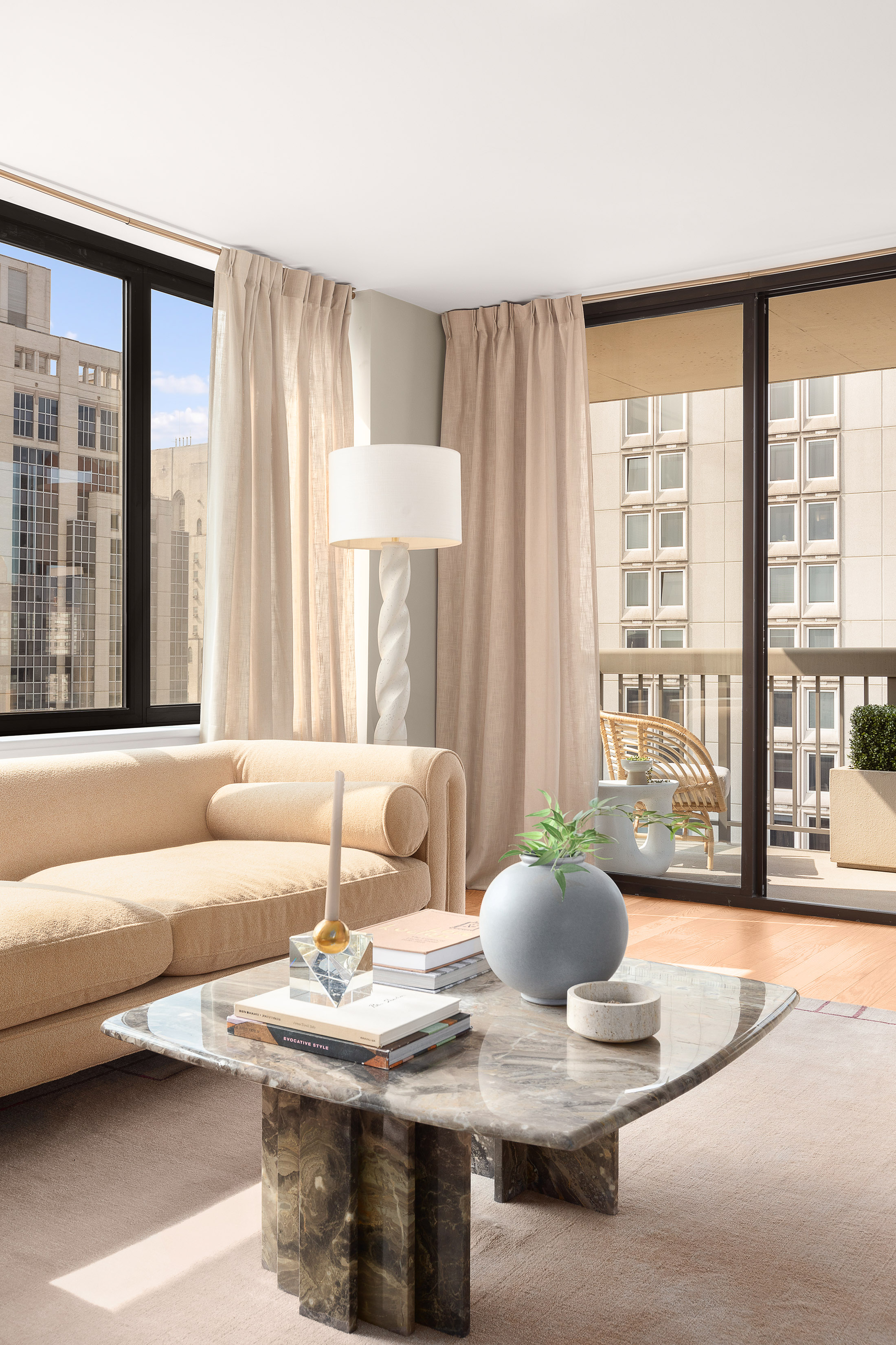 422 East 72nd Street, Unit 27C Manhattan, NY 10021 - Photo 4 of 25 a living room with furniture and large windows