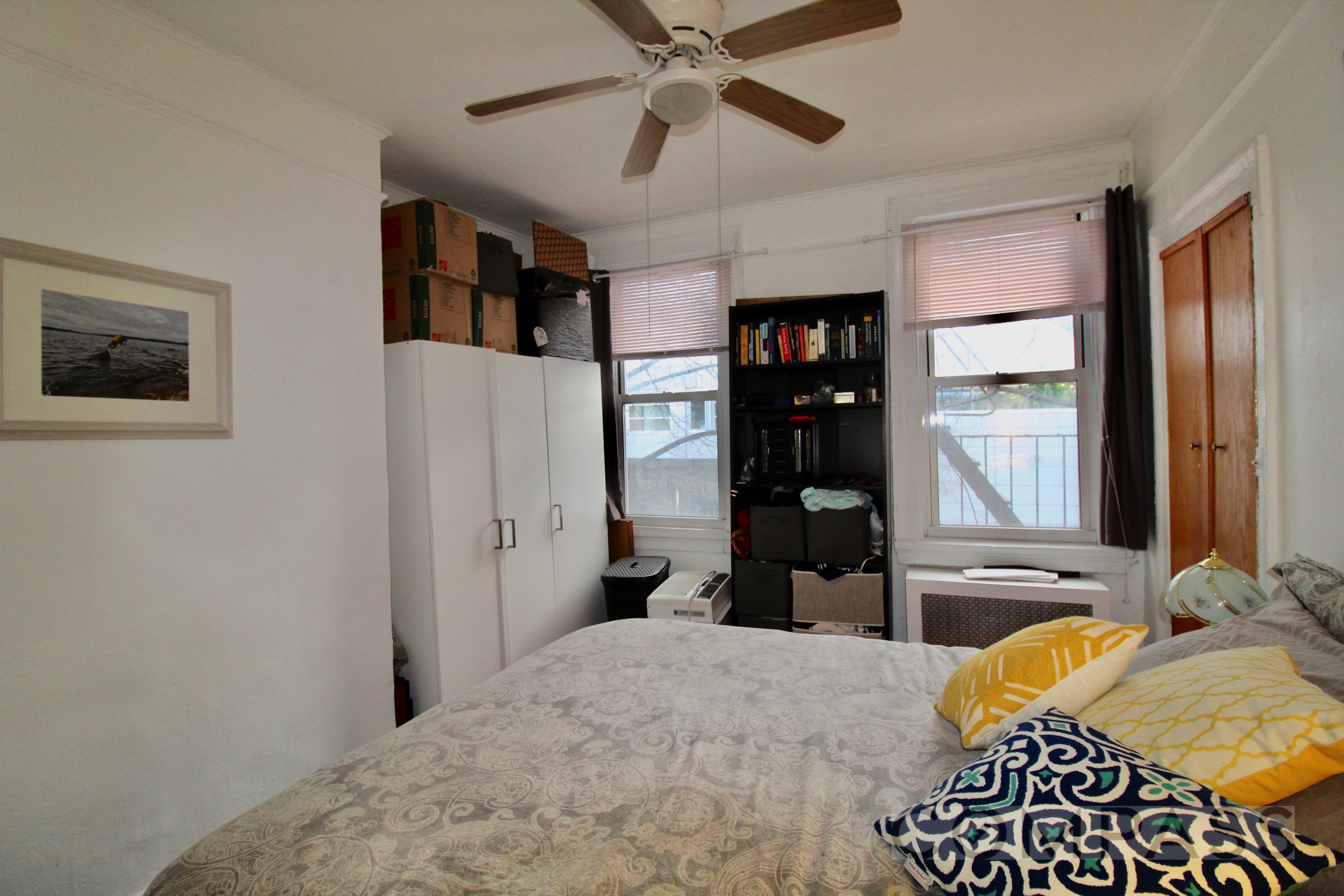 53 Duffield Street, Unit 3 Brooklyn, NY 11201 - Photo 4 of 11 a bedroom with a bed and a chandelier