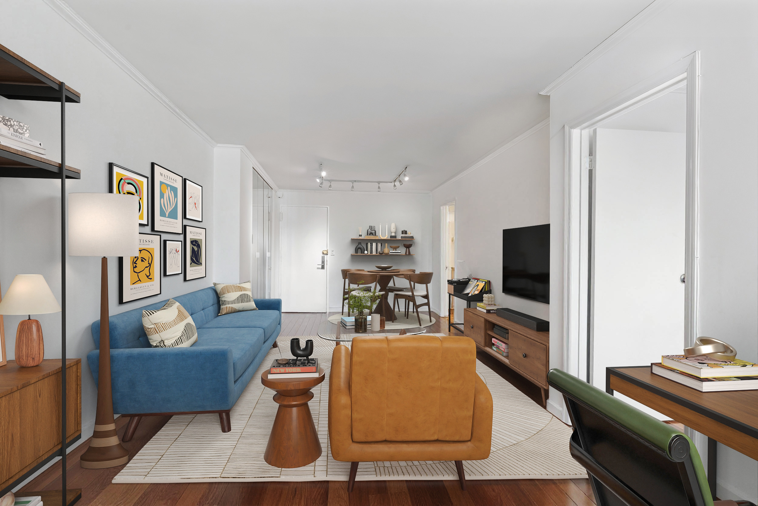 201 East 21st Street, Unit 11H Manhattan, NY 10010 - Photo 3 of 10 a living room with furniture and a flat screen tv