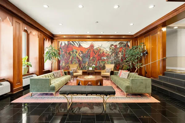 a white kitchen with a stove a table and chairs