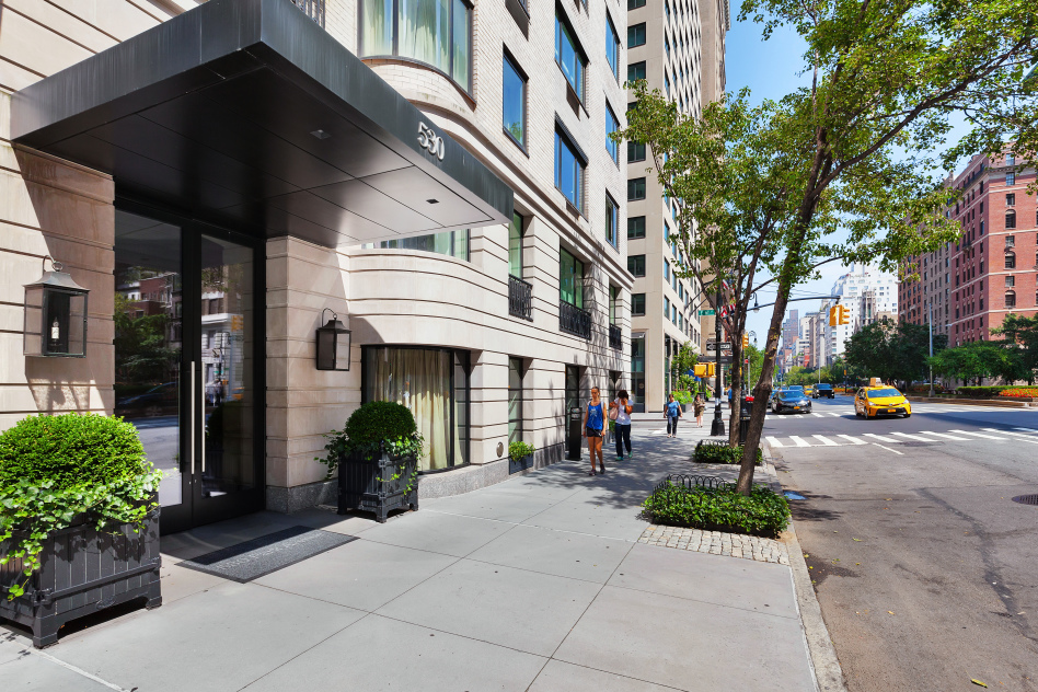 530 Park Avenue, Unit 4A Manhattan, NY 10065 - Photo 15 of 16 a view of a building with car parked