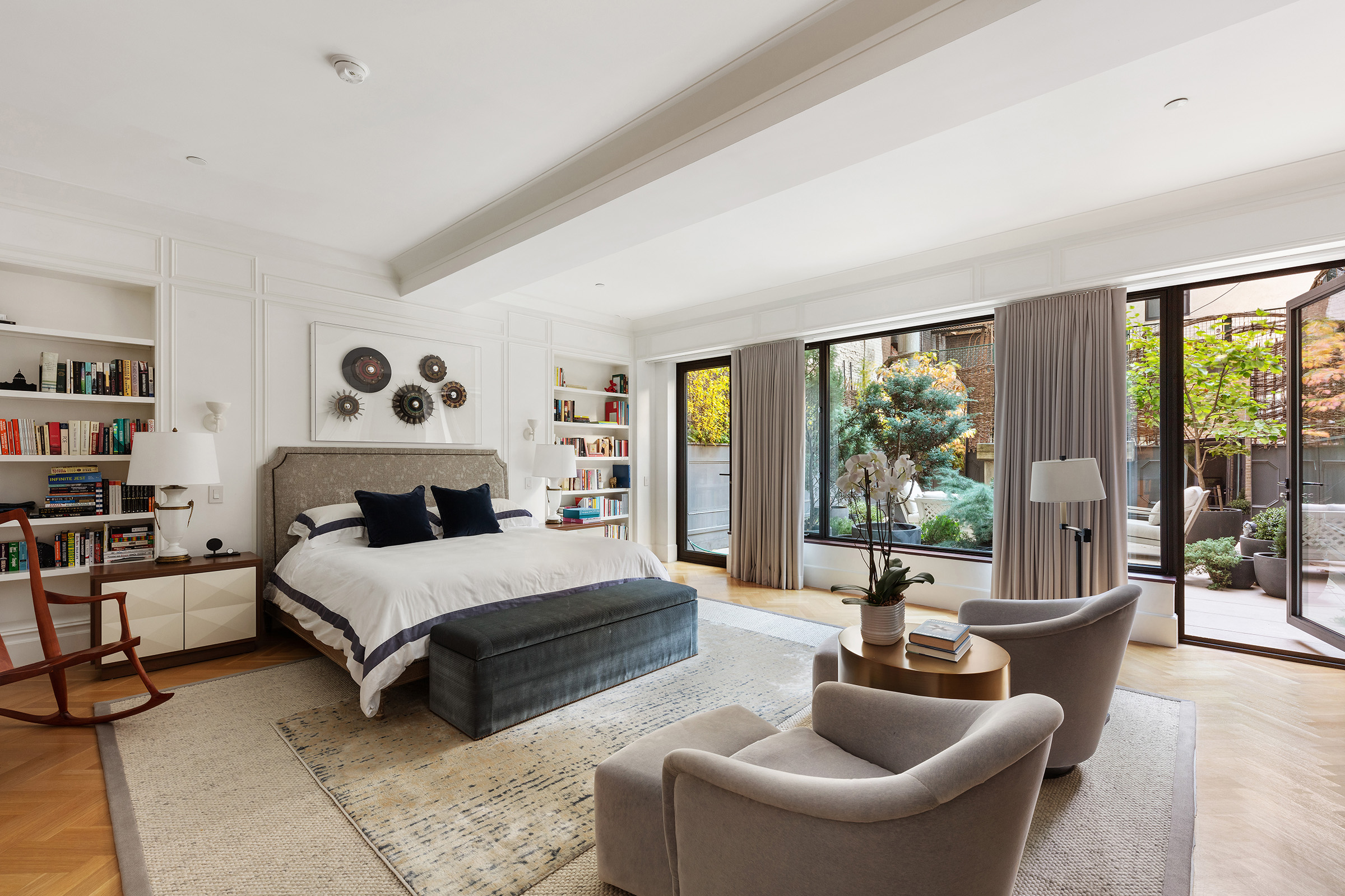 17 East 12th Street, Unit 2 Manhattan, NY 10003 - Photo 9 of 19 a spacious bedroom with a bed and glass window