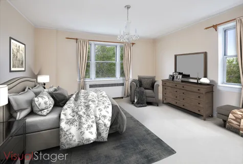 a bedroom with furniture and a large window