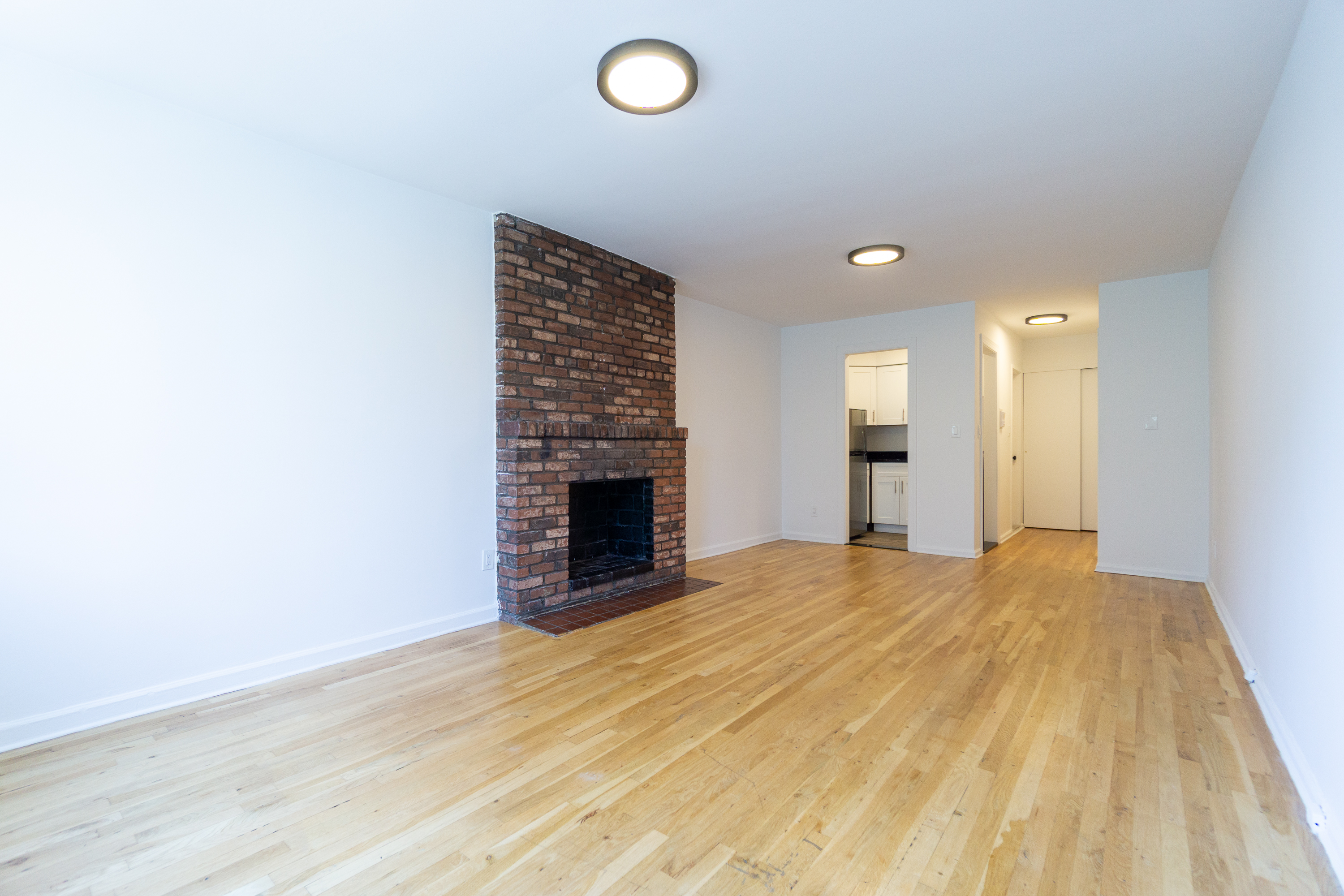 205 2nd Avenue, Unit 4A Manhattan, NY 10003 - Photo 3 of 13 a view of empty room with a fireplace